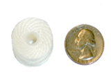 Style M bobbin compared to U.S. quarter